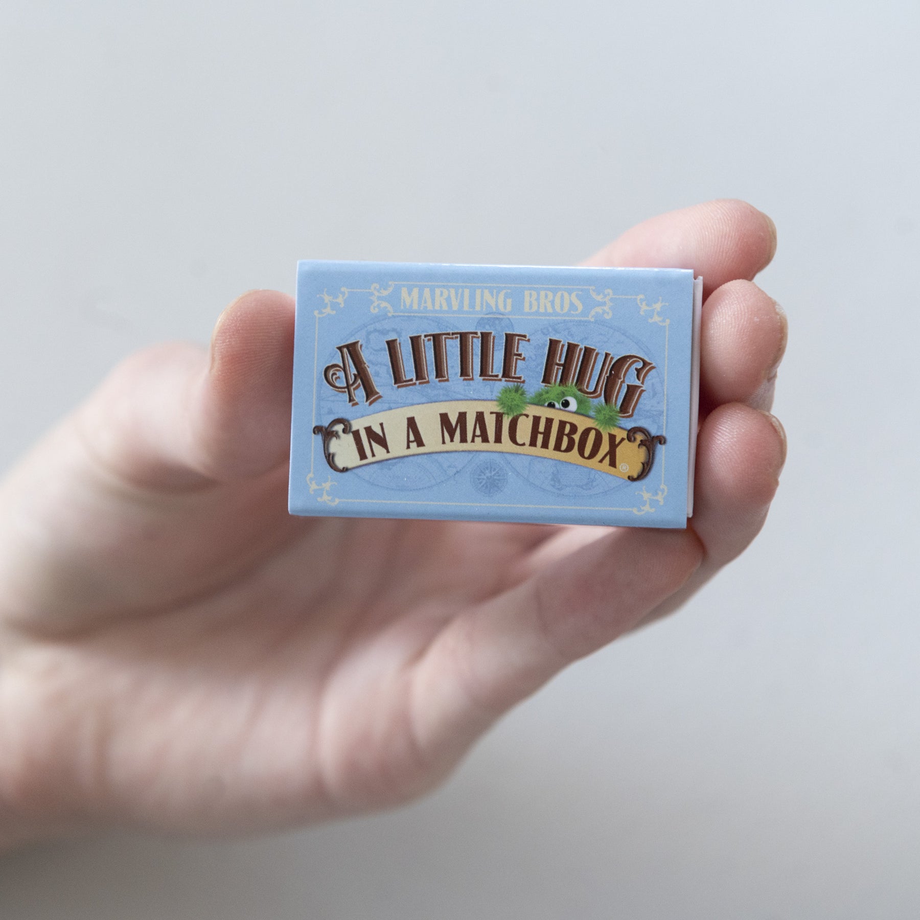 A Blue Little Hug in a matchbox