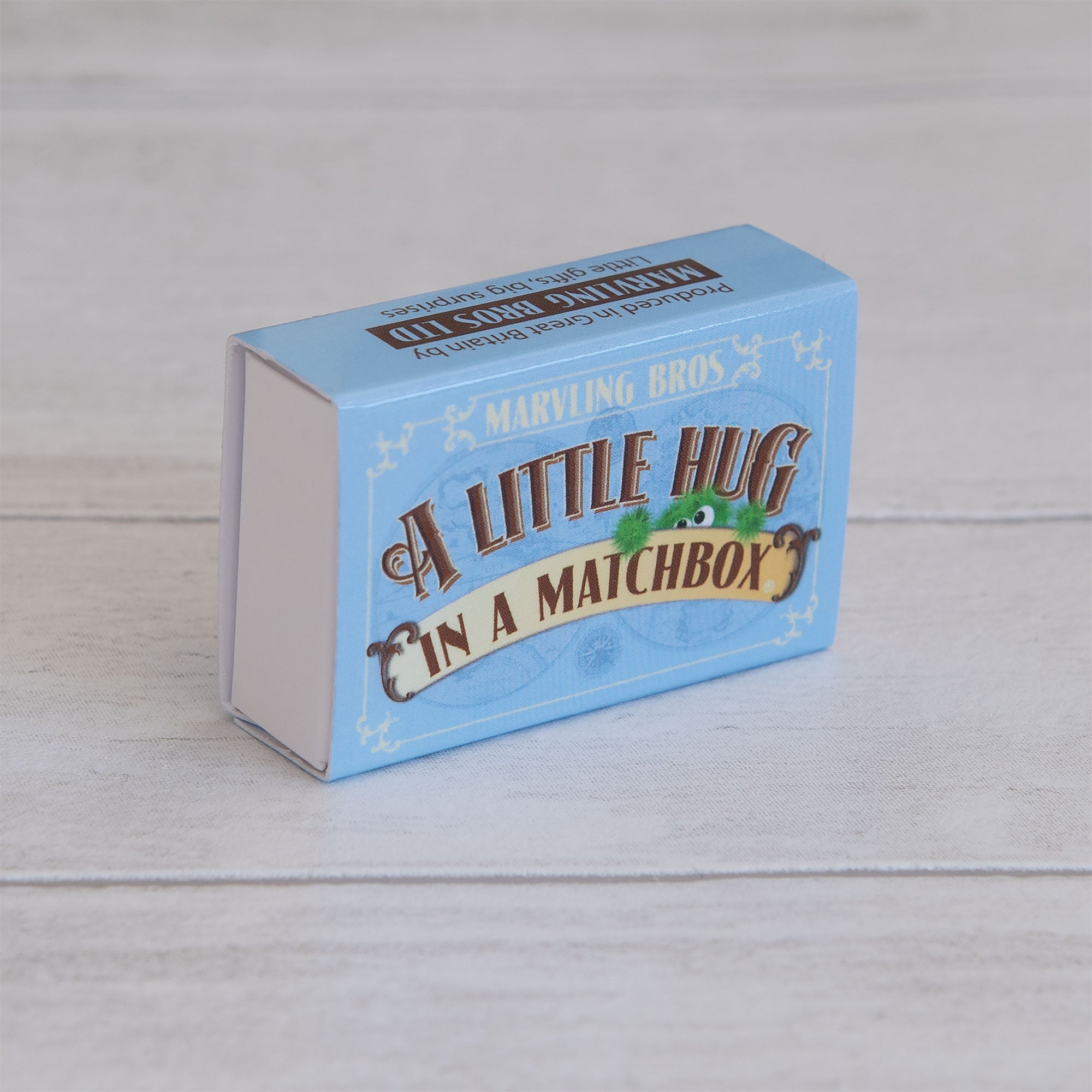 A Blue Little Hug in a matchbox