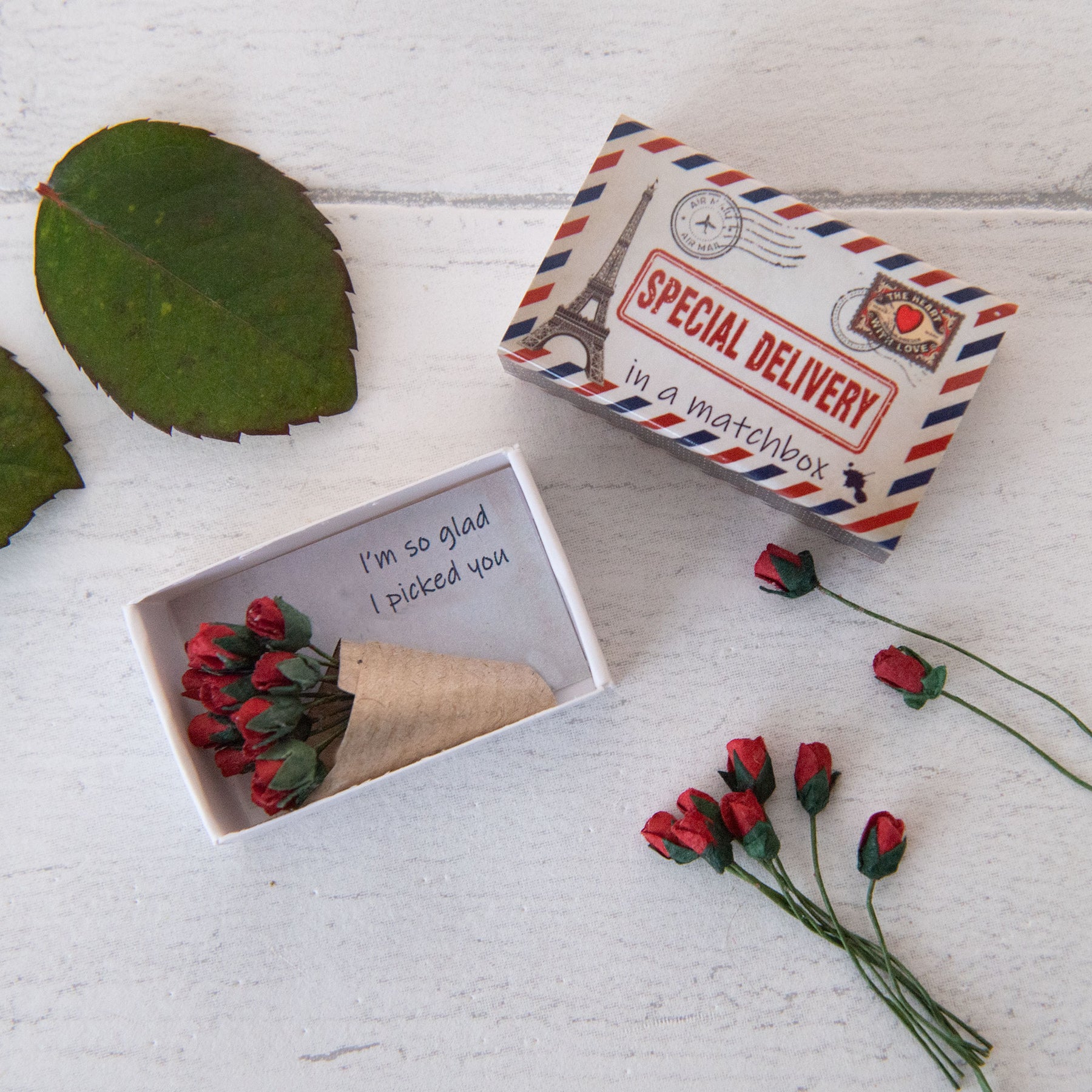 a dozen miniature paper roses gift in a matchbox